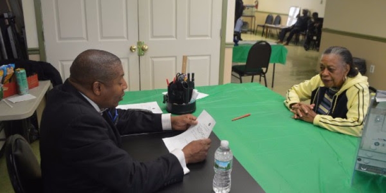 Senator Sanders spoke with constituents one-on-one regarding their specific concerns. Here, he goes over a constituent intake form with one of the attendees.