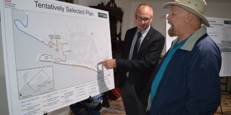 Daniel T. Falt, Project Manager, U.S. Army Corps of Engineers, New York District explains the tentatively selected plan to one of the attendees at the meeting.