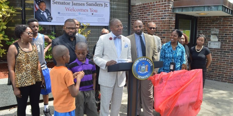 Senator Sanders joins Kelvin Watson, Chief Operating Officer and Senior Vice President of Queens Library, and Kevin Livingston of 100 Suits For 100 Men, in announcing new handicapped accessible features which will allow even more residents to take advantage of the library's many services and programs.