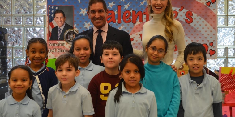 Photo caption: (left to right): Senator Jeff Klein, Miss USA Olivia Jordan, and P.S. 105 students pay tribute to the veterans.