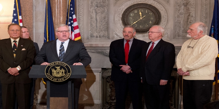 Senator O'Mara speaks at a Senate news conference calling for state support for the project. Dr. Frank Bourke of Corning is shown at the far right.
