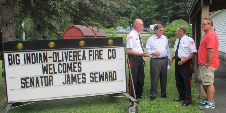 Senator Seward chats with local leaders prior to announcing a $250,000 state grant to help fund a firehouse expansion for the Big Indian-Oliverea Fire Department. From left, Big Indian-Oliverea Fire Chief John “Jody” Rossitz, Senator James L. Seward, Big Indian-Oliverea President George Long, Town of Shandaken Supervisor Rob Stanley.