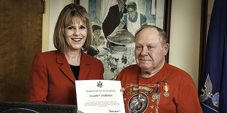 Senator Catharine Young presents U.S. Marine Corps Corporal William Lindbergh with the Department of Defense’s Cold War Recognition Certificate.
