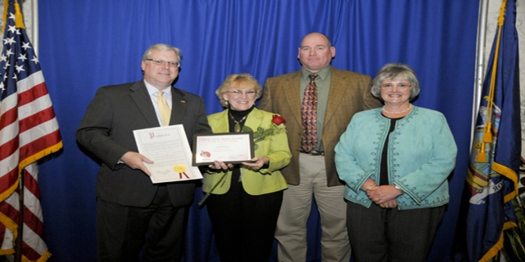 At the Senate's 2011 "Women of Distinction" awards ceremony in Albany, from left to right: Senator O'Mara, the senator's inaugural "Woman of Distinction" Carol Berry, Carol's son Richard, and Lorraine Patti, then-President of the Dormann Library Board of Trustees.