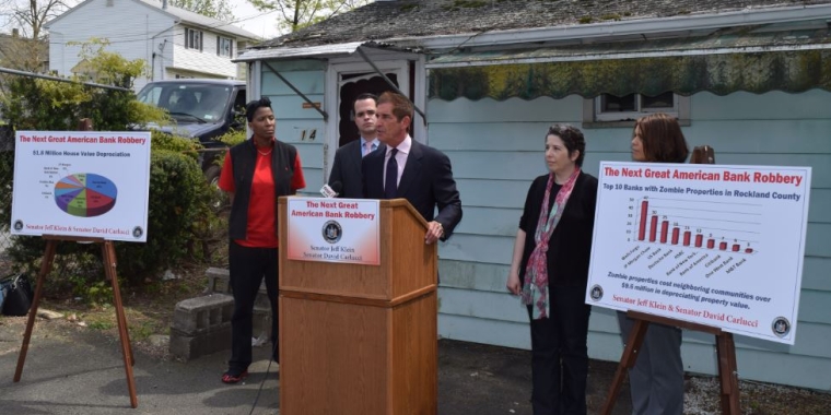 Photo: Senator Jeff Klein discusses his legislation that would combat community blight and protect property values